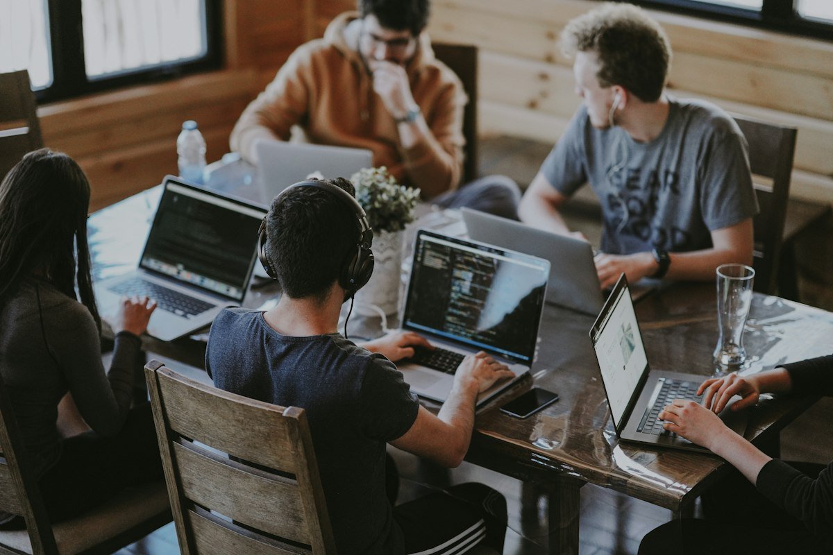IT team working on laptops